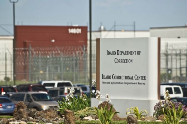 sign in front of prison that reads "Idaho Department of Correction Idaho Correctional Center"