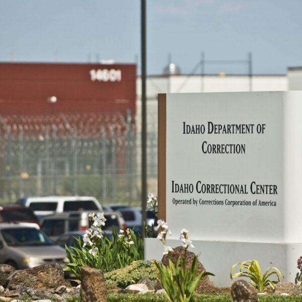 sign in front of prison that reads "Idaho Department of Correction Idaho Correctional Center"