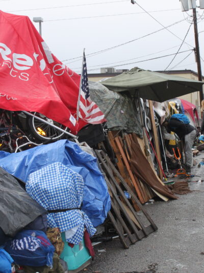 Cooper court encampment with police officers in the background