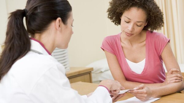 a female doctor talking to a female patient