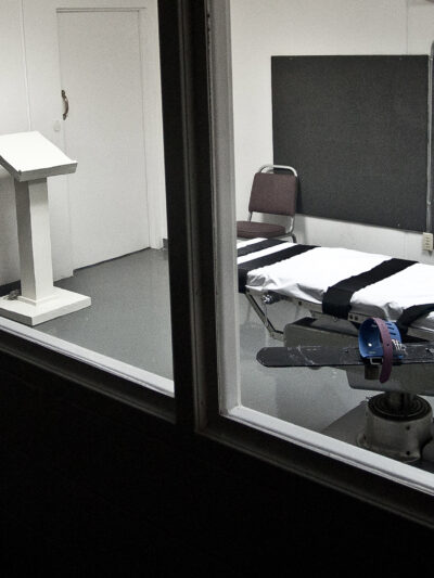 Empty lethal injection execution chamber with injection table and podium