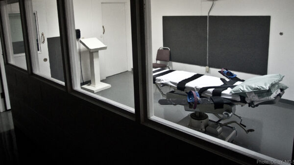 Empty lethal injection execution chamber with injection table and podium