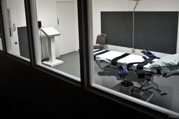 Empty lethal injection execution chamber with injection table and podium