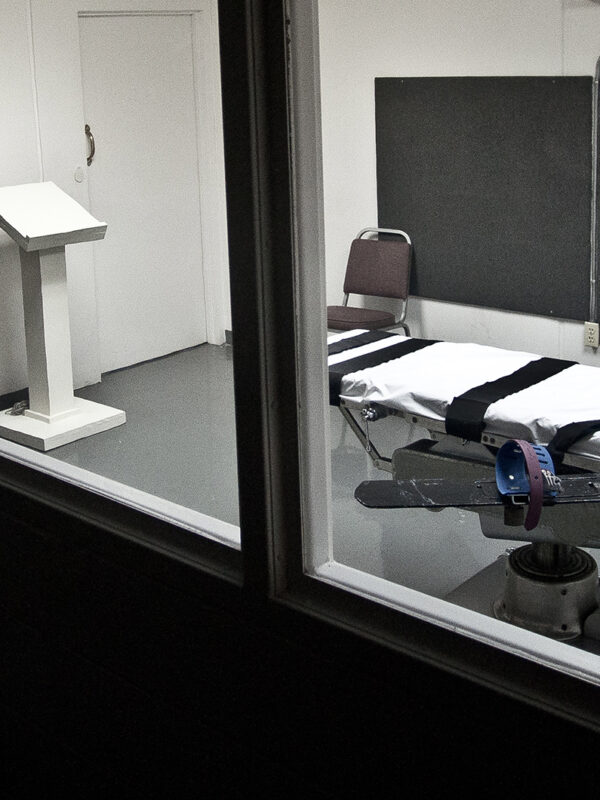 Empty lethal injection execution chamber with injection table and podium