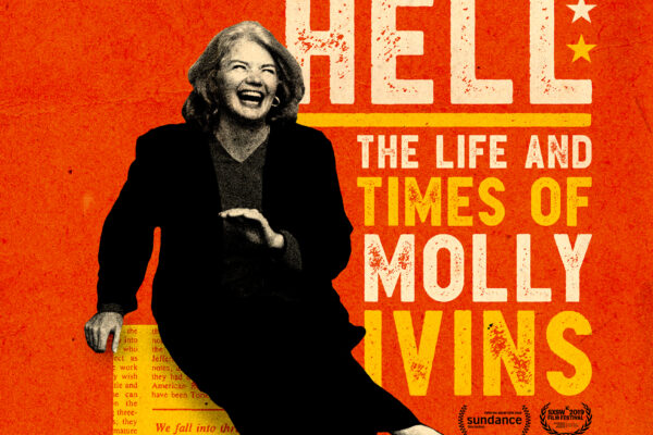 Molly Ivins in black suit laughing and sitting on the state of Texas