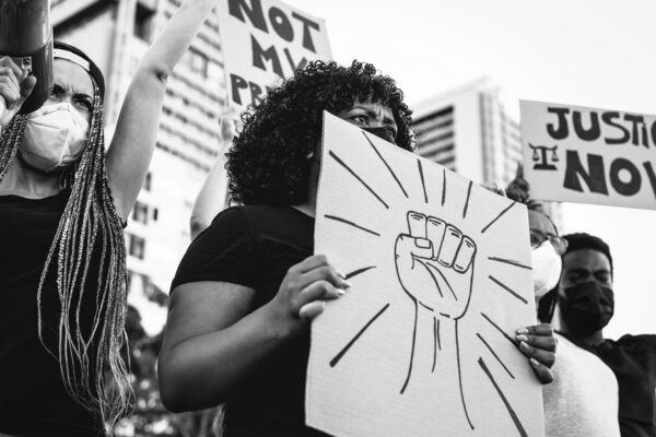 Black lives matter international activist movement protesting against racism and fighting for justice - Demonstrators from different cultures and race protest on street for equal rights