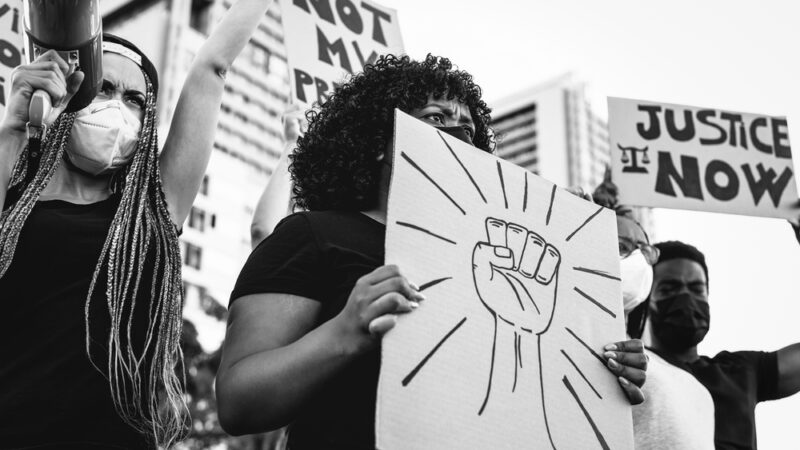 Black lives matter international activist movement protesting against racism and fighting for justice - Demonstrators from different cultures and race protest on street for equal rights