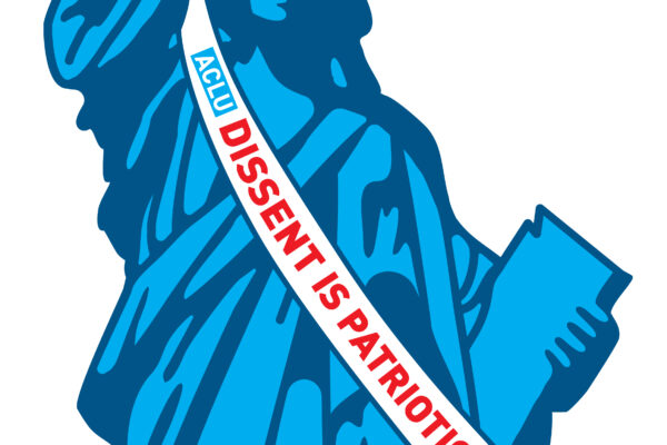 A picture of the Statue of Liberty with a raised clenched fist. She is wearing a long white ribbon in front with "Dissent is Patriotic" in red lettering.