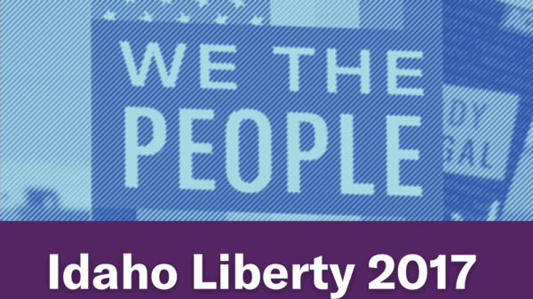 A blue image of a person holding a "We The People" sign. Text below the image reads "Idaho Liberty 2017"