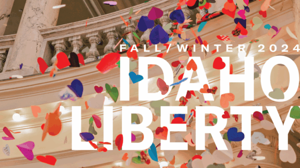 Multi colored hearts falling from the Idaho Capitol Rotunda are interspersed around the word "Fall/Winter 2024 Idaho Liberty"