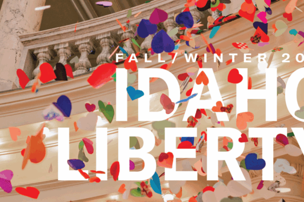 Multi colored hearts falling from the Idaho Capitol Rotunda are interspersed around the word "Fall/Winter 2024 Idaho Liberty"