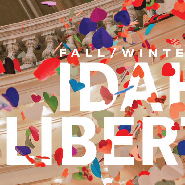 Multi colored hearts falling from the Idaho Capitol Rotunda are interspersed around the word "Fall/Winter 2024 Idaho Liberty"
