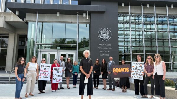 A group of activists stand outside the Idaho federal court building, led by a local Idaho pastor