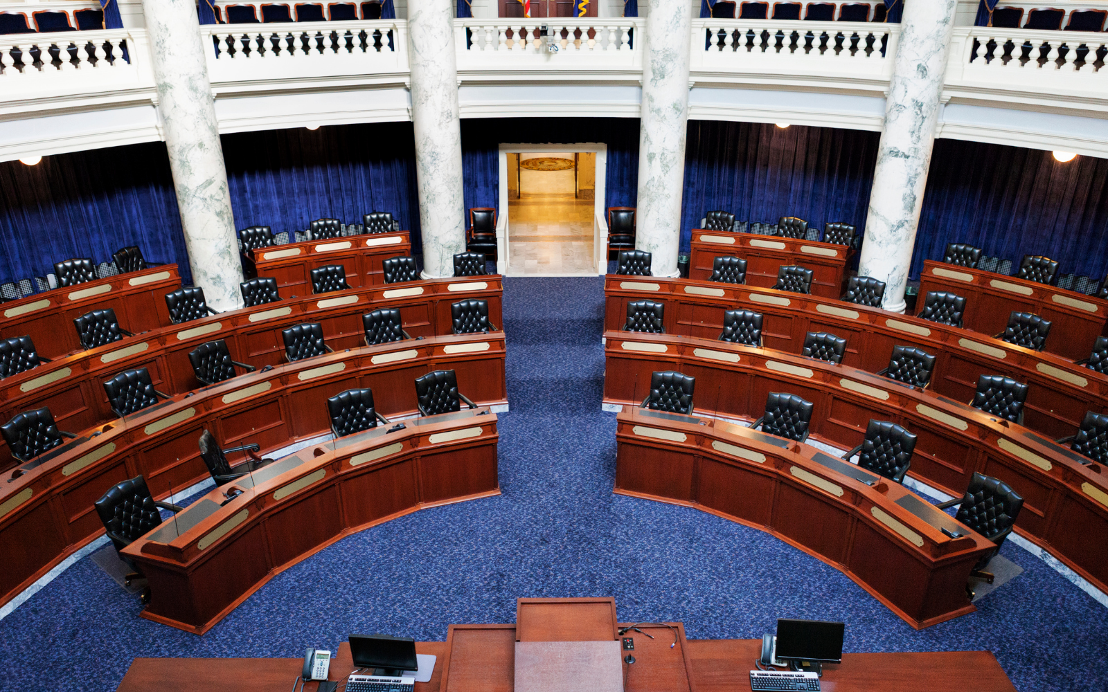 Photo of empty chairs in the Idaho State Capitol Senate Chambers