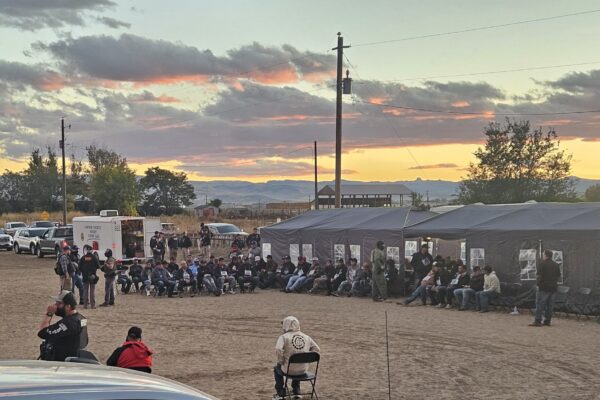 Image of people being questioned by immigration agents in Wilder, Idaho