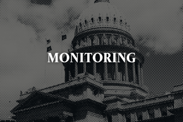 Gray image of the Idaho capitol with text "monitoring"