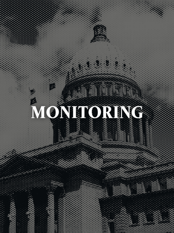 Gray image of the Idaho capitol with text "monitoring"