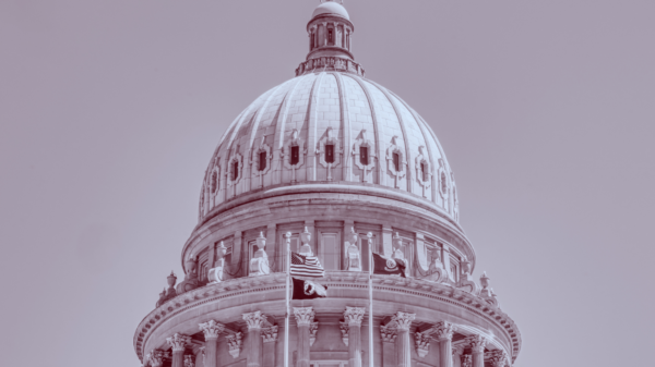 Red and blue duotone image of the Idaho Capitol building