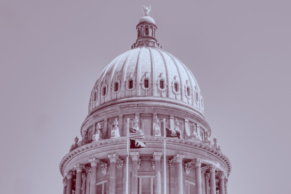 Red and blue duotone image of the Idaho Capitol building