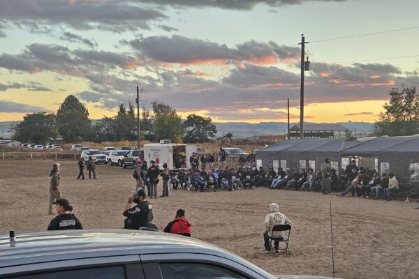 A large number of community members are detained and questioned by law enforcement in Wilder, Idaho.