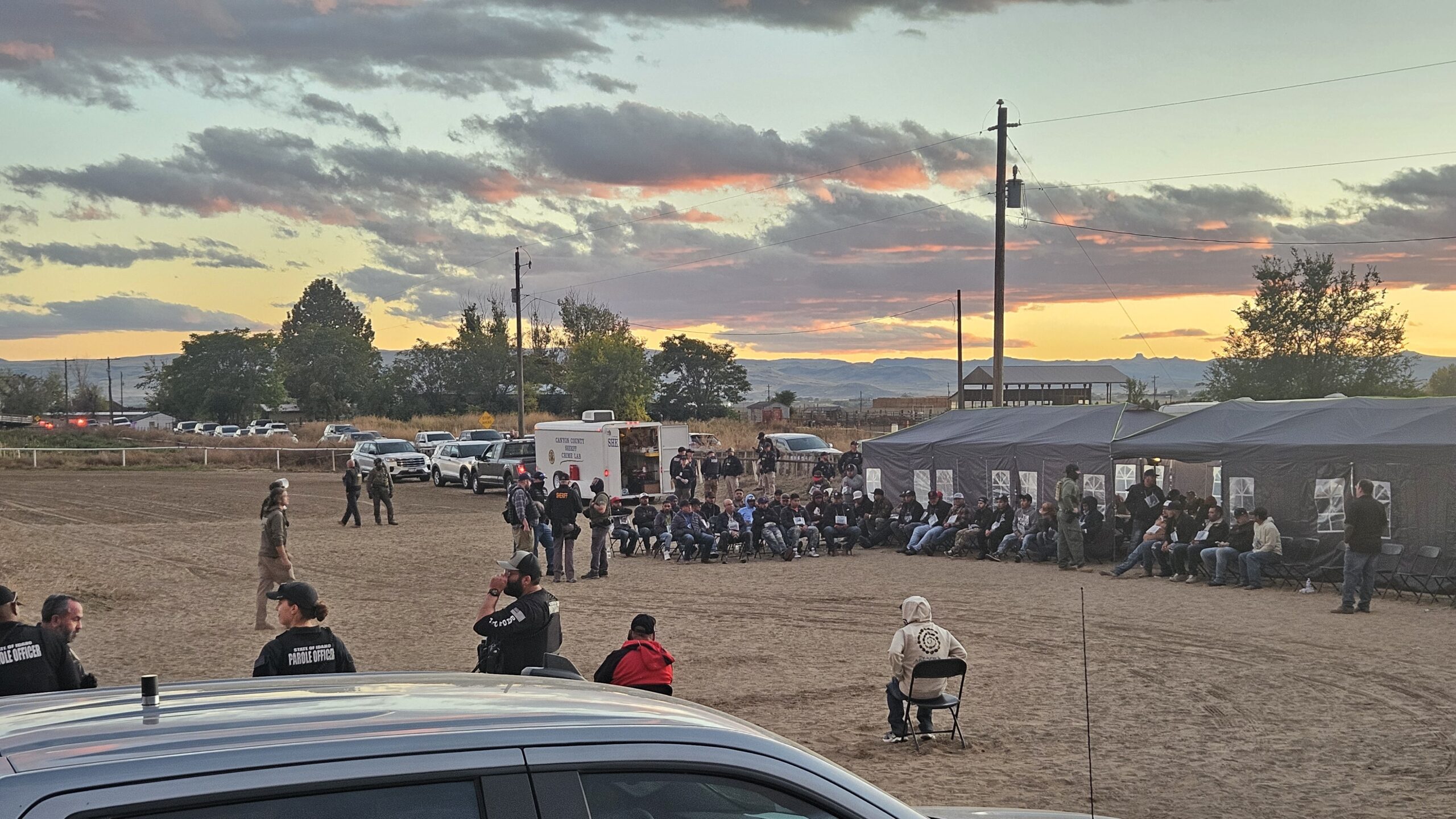 A large number of community members are detained and questioned by law enforcement in Wilder, Idaho.