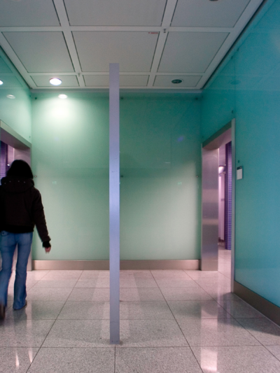 Person is walking into the women's bathroom in a public place