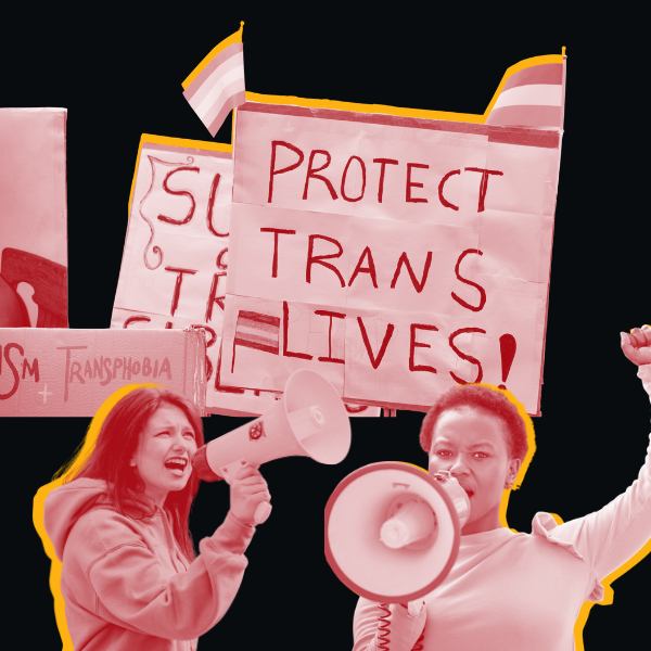 People are yelling in megaphones and signs read "protect trans lives"