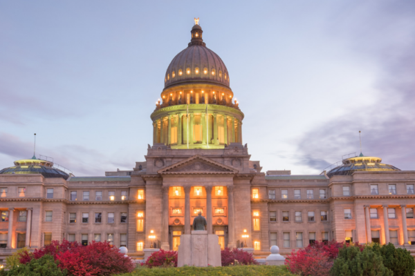 Front of the Idaho capitol lit up at dusk