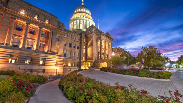 View looking up to the Idaho Capitol lit up at dusk