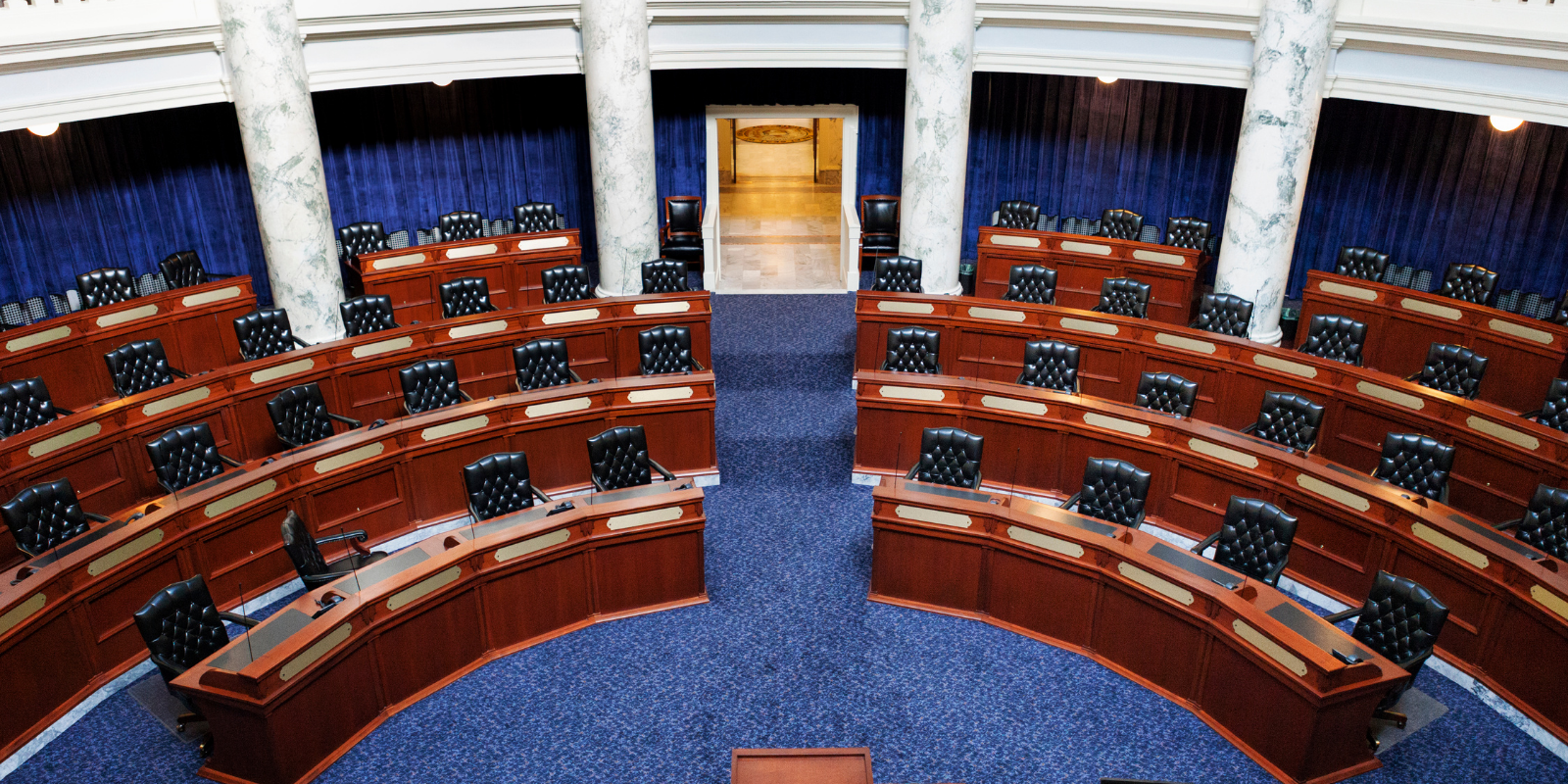 Photo of empty chairs in the Idaho State Capitol Senate Chambers