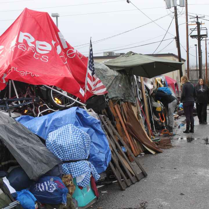 Cooper Court encampment Cooper court encampment with police officers in the background