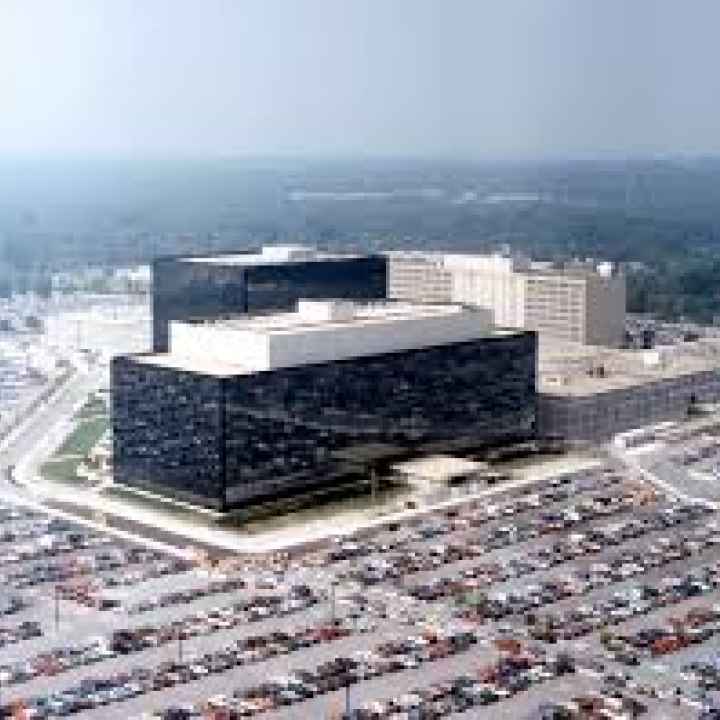 The NSA building from a distance, shown with parking lots surrounding it. 